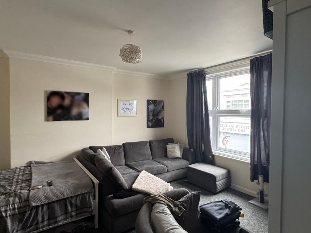 Lot: 41 - TWO TWO-BEDROOM AND TWO ONE-BEDROOM TOWN CENTRE FLATS FOR INVESTMENT - The Living Room in a First Floor Flat